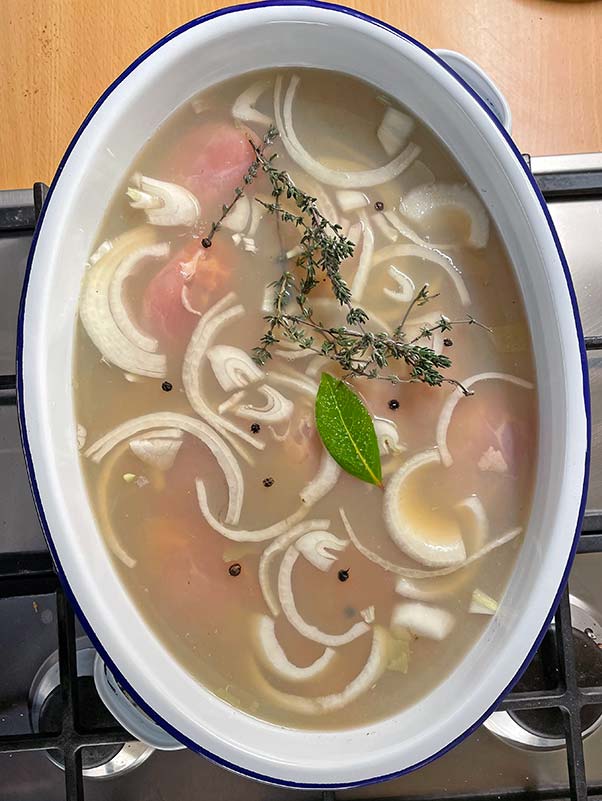 Mustard and herb poached chicken ready for the oven