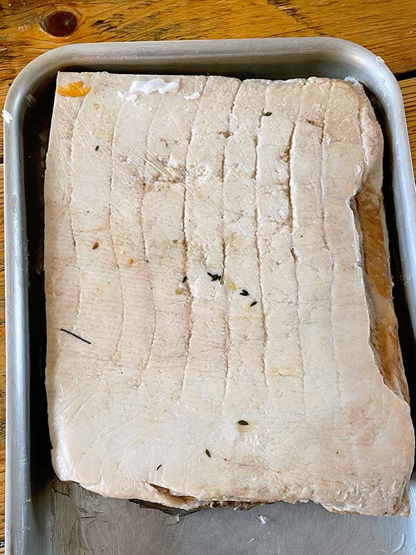Pressed cider braised pork belly ready to marinate