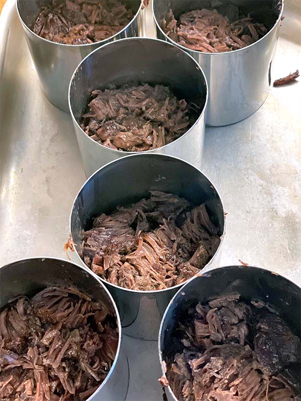 Shredded beef in ring moulds