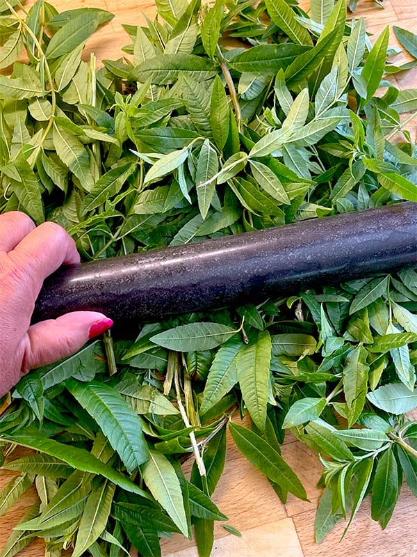 Crushing lemon verbena leaves