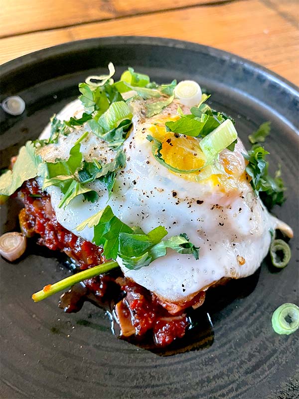 Eggs with smokey spicy sauce served