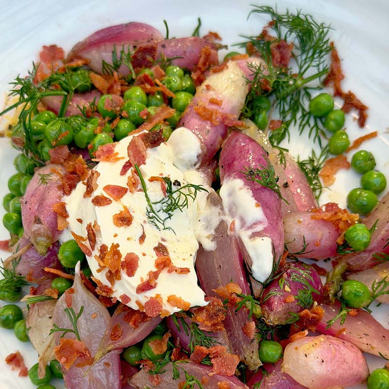 Butter glazed radish with peas and dill